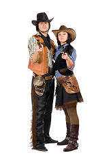 Image showing Young cowboy and cowgirl with a guns