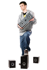 Image showing Young man with a four speakers