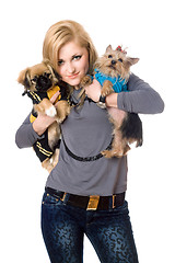 Image showing Smiling blonde posing with two dogs