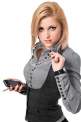 Image showing Portrait of young blonde with smartphone. Isolated