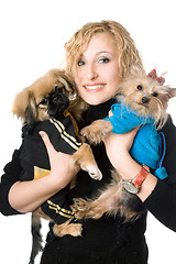 Image showing Portrait of smiling pretty blonde with two dogs. Isolated