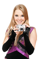 Image showing Smiling blonde holding a photo camera. Isolated