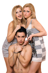 Image showing Two blonde and a guy in chains