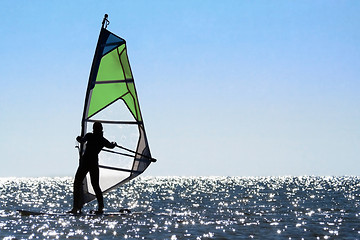 Image showing Silhouette of a woman windsurfer