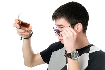 Image showing Young man with a glass