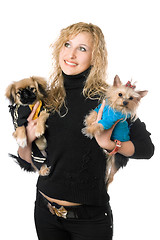 Image showing Portrait of happy young blonde with two dogs