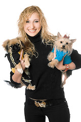 Image showing Portrait of joyful young blonde with two dogs