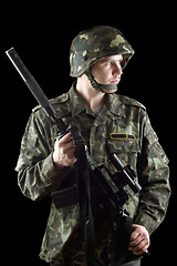 Image showing Soldier grasping a gun