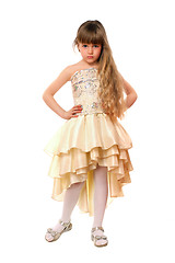 Image showing Beautiful little girl in a beige dress