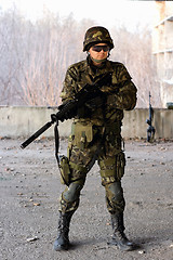 Image showing Military guy holding a gun