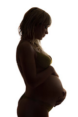 Image showing Silhouette of a pregnant young woman. Isolated