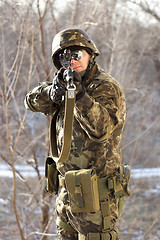 Image showing Portrait of soldier with a gun