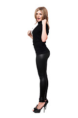 Image showing Sexy young woman in leggings. Isolated