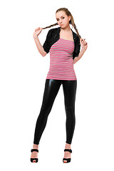 Image showing Playful pretty young woman in black leggings