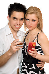 Image showing Smiling beautiful young couple with cocktails