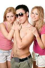 Image showing Two pretty blond women with young man