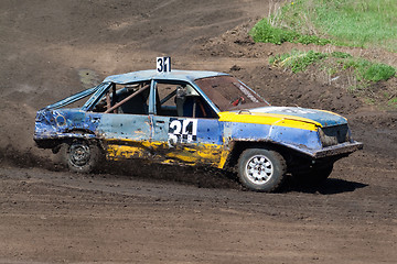 Image showing Race for survival. Blue yellow car 