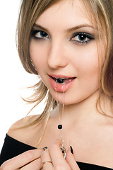 Image showing Portrait of beautiful young woman with a bead