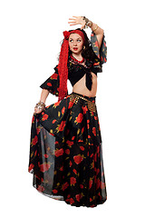 Image showing Dancing gypsy woman in a black skirt. Isolated