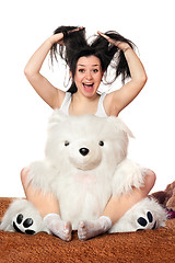 Image showing Joyful girl with a teddy bear