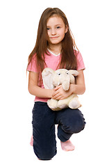 Image showing Pretty little girl with a teddy elephant