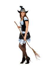 Image showing Pretty young woman with a besom