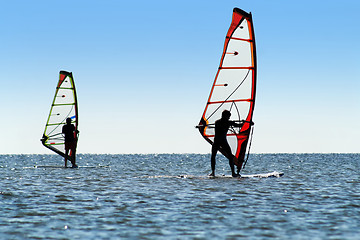 Image showing Silhouette of a two windsurfers