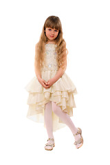 Image showing Cute little girl in a beige dress