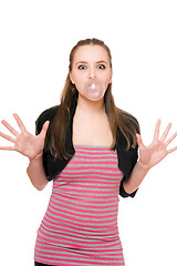 Image showing Young woman blowing a bubble