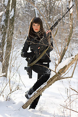 Image showing Attractive woman with a sniper rifle