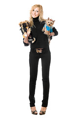 Image showing Happy blonde posing with two dogs