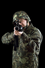 Image showing Armed man pointing a gun