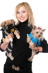 Image showing Portrait of smiling pretty young blonde with two dogs