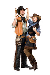 Image showing Cheerful young cowboy and cowgirl