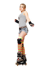 Image showing Attractive young blonde on roller skates