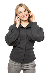 Image showing Portrait of smiling young blonde in a gray business suit