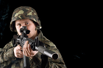 Image showing Man keeping a gun in studio