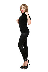 Image showing Pretty young woman in leggings. Isolated on white