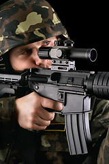 Image showing Armed soldier taking aim