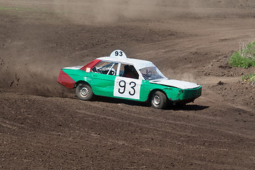 Image showing Race for survival. White green car