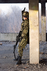 Image showing Adult man with rifle and gun