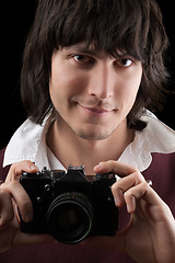 Image showing Photographer with the vintage camera. Isolated