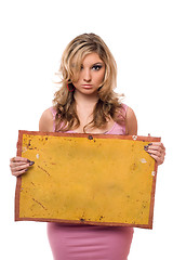 Image showing Young woman posing with yellow board