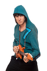 Image showing Bizarre man with a little guitar. Isolated