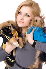 Image showing Portrait of pretty young blonde with two dogs. Isolated