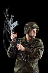 Image showing Soldier threatening with a rifle