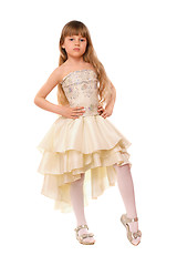 Image showing Pretty little girl in a beige dress