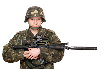 Image showing Soldier hugging m16