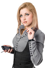 Image showing Portrait of attractive young blonde with smartphone. Isolated