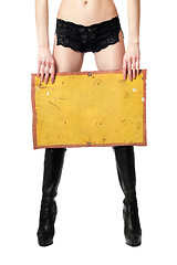 Image showing Sexy woman with yellow vintage board. Isolated